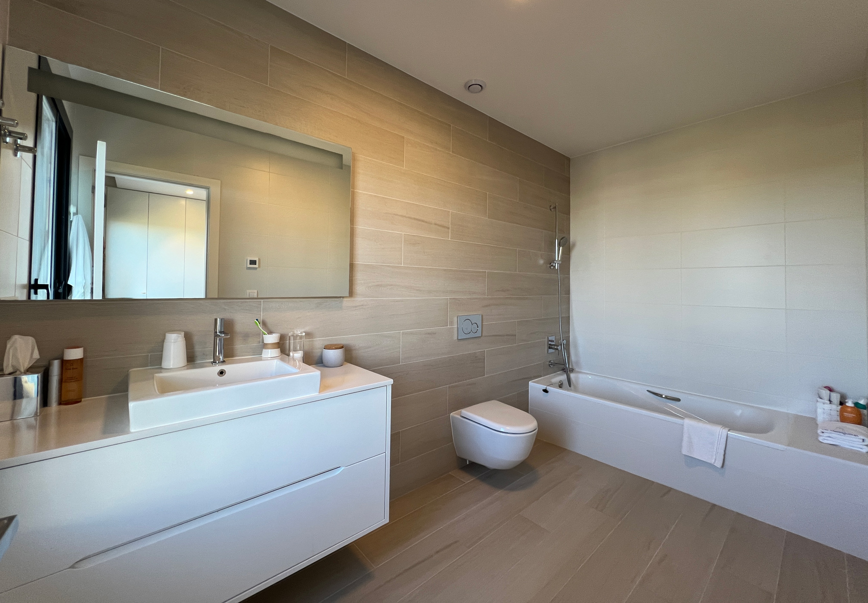 Master bathroom with bathtub