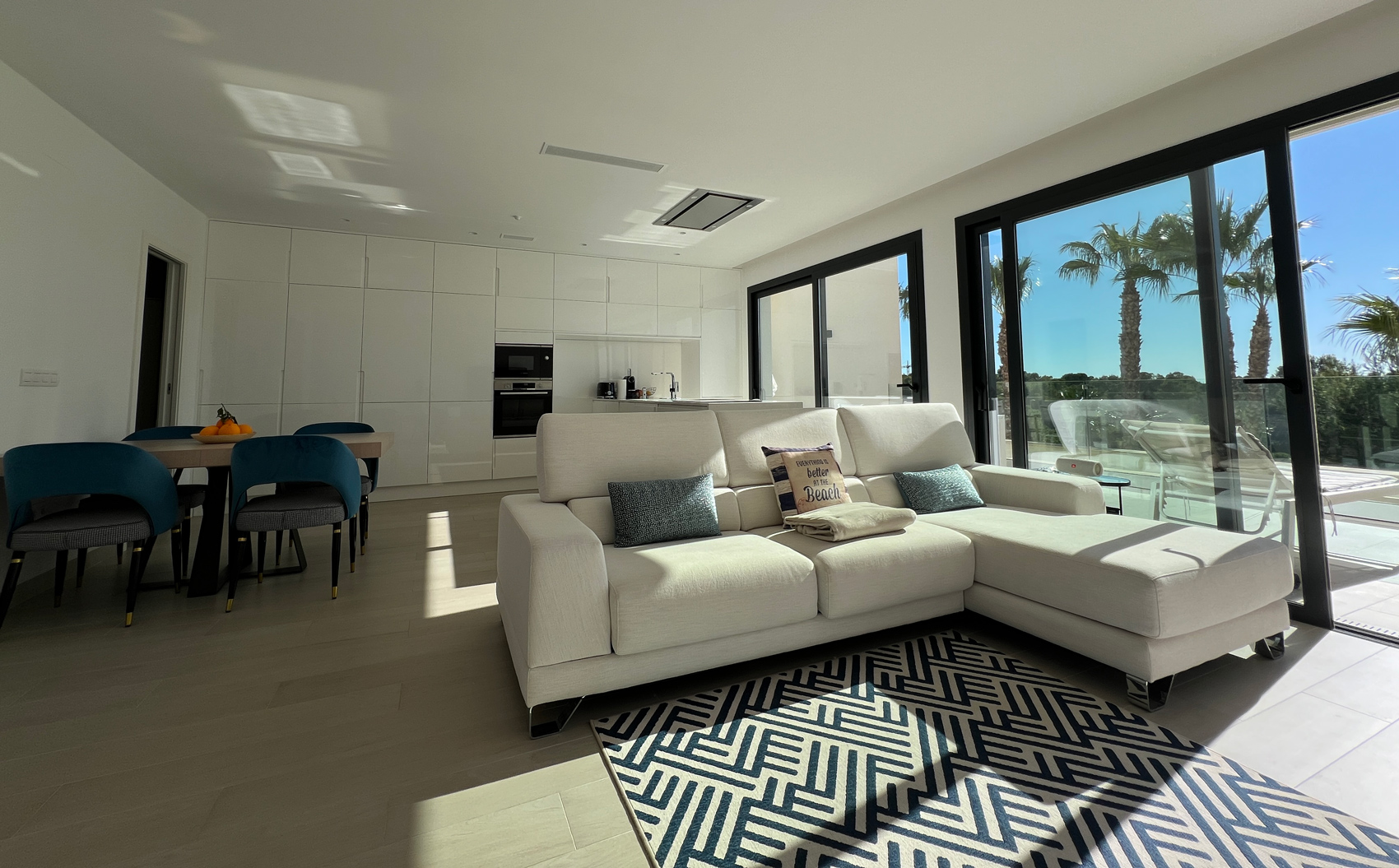 Bright living room with palm view